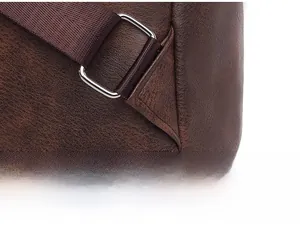 Macro shot of reinforced triangular stitching and metal buckle on leopard backpack strap