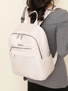 Stylish beige nylon backpack for women with dual zipper pockets and waterproof design