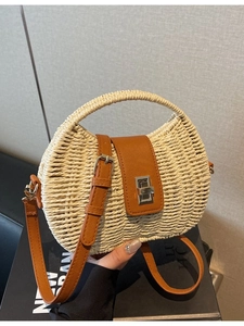 French woven straw crossbody bag with brown leather flap and silver metal turn lock