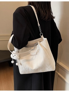 Large white minimalist tote bag with plush cloud charm and metal chain shoulder strap