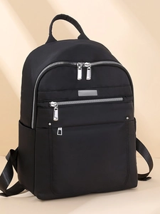 Fashionable black nylon backpack for women with silver zippers and side pockets