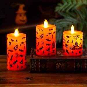 Set di 3 candele LED arancioni per Halloween con motivi RIP e ragni su libri
