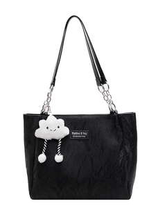 Minimalist black tote bag with silver chain and cute cloud charm on white background