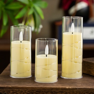 Three battery-operated LED flameless candles with warm string lights in glass jars