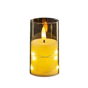 Flameless LED candle in clear glass cylinder with fairy lights and warm flickering flame