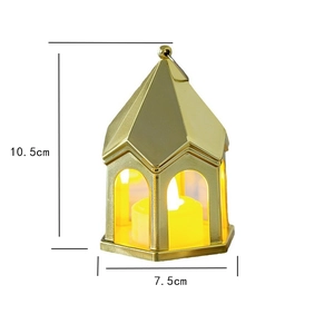 Detail of 10.5cm vintage gold LED lantern with arched windows and glowing warm light