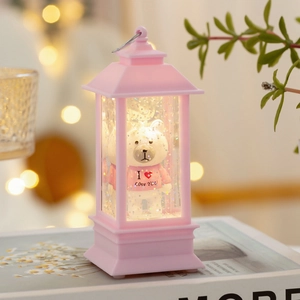 Detailed close-up of pink bear lantern with sparkling glitter and I Love You text