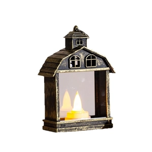 Retro house-shaped LED lantern with warm yellow light and antique metal finish