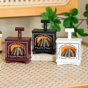 Miniature fireplace decorations for dollhouses in black, white, and brown with fire effect