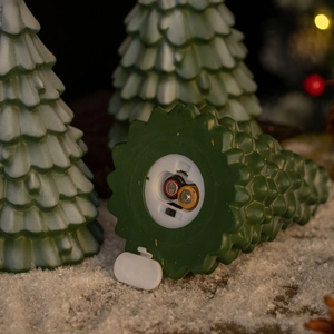 Detail view of the Christmas tree lamp base with battery compartment and power switch