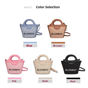 Vista detallada de la colección de mini bolsos bombonera en cinco colores con asas de cuero