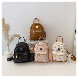 Mini preppy backpacks with teddy bear patterns in black, brown, pink, and off-white colors