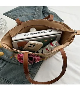 Detailed top view of large straw tote bag showing high capacity storage space