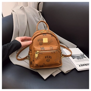 Detailed macro view of brown faux leather texture with bear print and golden zipper