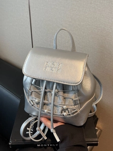 Mini silver metallic backpack with pearl accents and drawstring design for women