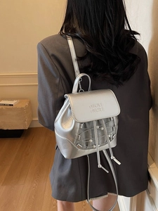 Chic silver metallic backpack with drawstring and pearl detail for commuting