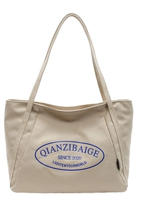 Bolso tote grande de lona beige con estampado de logo azul para uso diario informal
