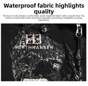Détail du tissu fonctionnel imperméable avec gouttes d'eau et fermeture éclair du sac à dos