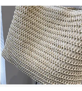 Macro detail of breathable straw weave texture and natural beige material on tote bag