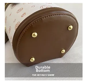 Détail du mini sac seau avec rivets de protection en métal résistant à l'usure