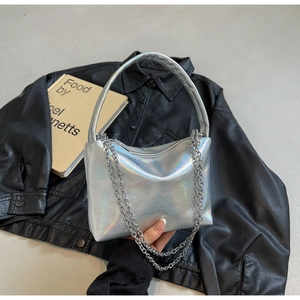 Detail of silver laser leather handbag with metallic chain and pleated texture