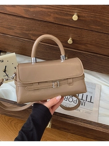 Classic khaki faux leather crossbody bag with top handle and decorative buckle strap