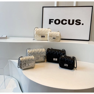 Detailed comparison of quilted chain bags in white, silver, and black in two different sizes