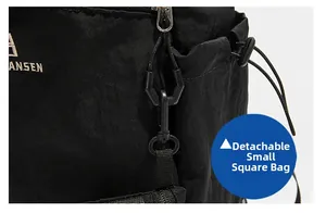 Detail view of the detachable mini pouch component and side pocket on the hiking backpack