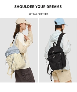 Detail view of water-resistant hiking backpack with multi-pocket design and contrast colors