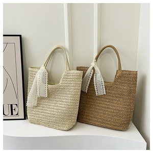 Detailed texture of hand-woven tote bags with elegant white lace bow ribbons