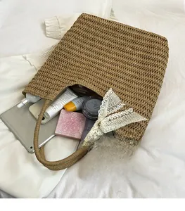 Top view of large straw tote bag with ribbon detail showing spacious interior storage
