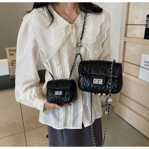 Size comparison of black quilted chain bags with silver rotary locks and leather straps