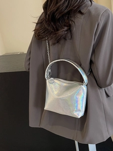 Chic silver laser crossbody bag with metallic chain strap and minimalist handle
