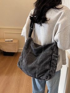 Vintage large denim tote bag with contrast stitching and adjustable wide shoulder strap