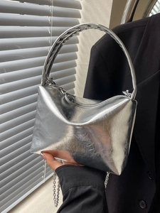 Silver metallic pillow bag with pleated texture and stylish chain shoulder strap