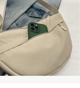 Detail of exterior zipper pocket showing high capacity for a large smartphone