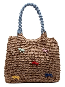 Handwoven straw tote bag with colorful knitted bows and light blue ruched fabric handles
