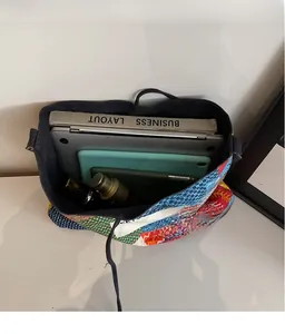 Spacious bohemian patchwork tote interior showing storage for laptop and books