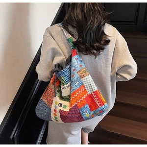Detailed patchwork tote bag featuring ethnic patterns and white SEEYOU textile label