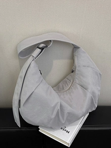 Chic silver pleated crescent shoulder bag with adjustable strap for daily commute