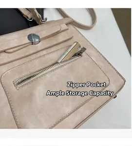 Detail of apricot crossbody bag with front zipper pocket and round metal buckle detail
