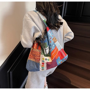 Close-up of colorful ethnic patchwork tote bag with geometric and floral canvas patterns