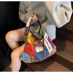 Detailed view of colorful bohemian patchwork canvas tote with SEEYOU label decoration