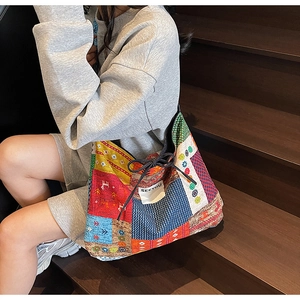 Detailed patchwork canvas tote bag with ethnic patterns and SEEYOU label decoration