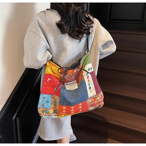 Detail of bohemian patchwork canvas tote bag with drawstring and SEEYOU label