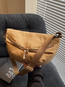 Modern khaki crescent crossbody bag made of durable matte nylon with adjustable strap