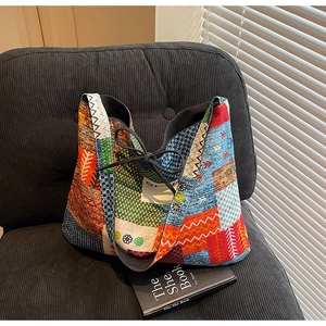 Close-up of the interior lining and brand label of a patchwork ethnic canvas tote bag