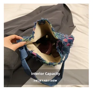 Spacious interior of contrast denim tote showing compartments for daily essentials