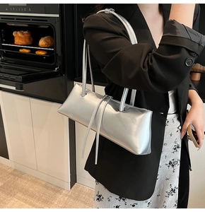 Chic silver baguette bag with metallic liquid texture and slim shoulder straps