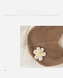 Macro detail of hand-woven hollow mesh texture with a white cotton flower charm